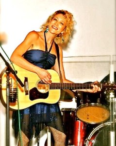 Maka Rouge, with guitar and original music.