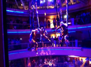 The aerial show hovers at deck seven over the Centrum lobby. The acrobats also dance in the production shows.