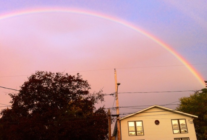 A rainbow lights up the golden hour in Syracuse, N.Y.