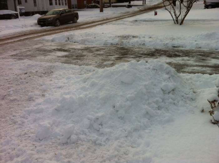 Already, a mound of removed snow is making a mountain where I must throw it.
