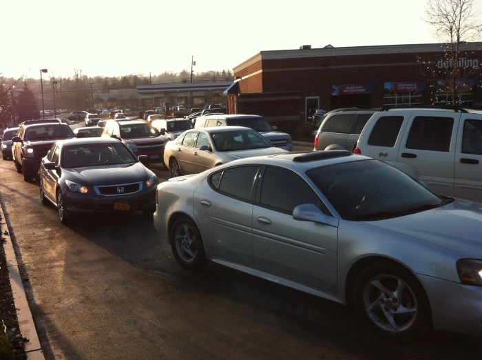 Back, back, back goes the line of cars awaiting the big clean in Syracuse, N.Y.