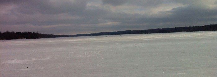 A lone ice fisherman tries his luck on Cazenovia Lake in Central New York.