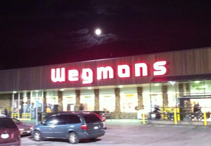 The moon proudly advertises itself over the supermarket tonight in Syracuse, N.Y.