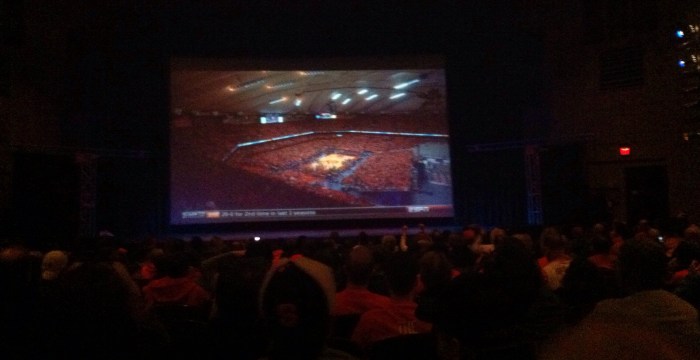 The Palace Theatre screen shows the sold out crowd at the Carrier Dome in Syracuse on Saturday night.