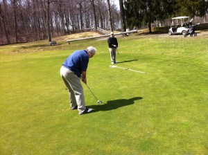KP gets set to putt on 11th green today at  Westvale as Wags looks over the line.
