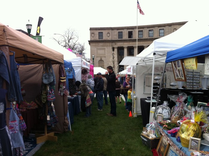 Arts, crafts, lawn, downtown and the American flag. Nice scene, Syracuse, N.Y.