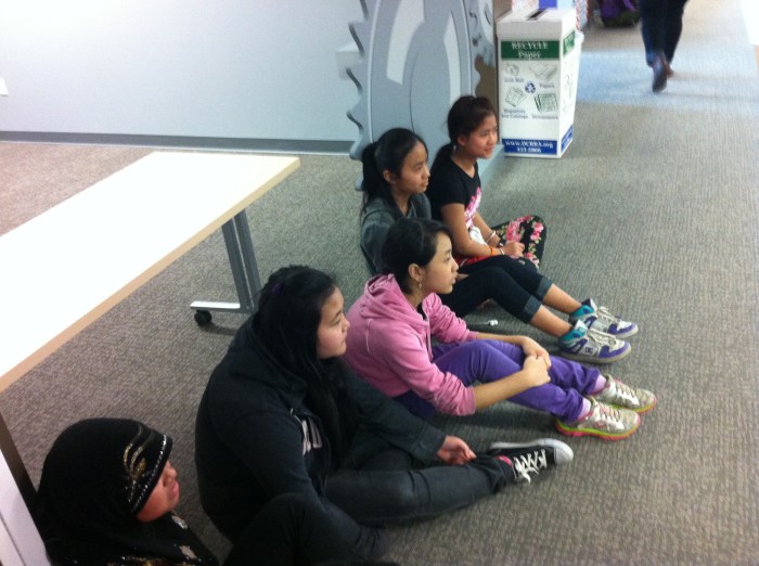 Listening and following the rules of their city.