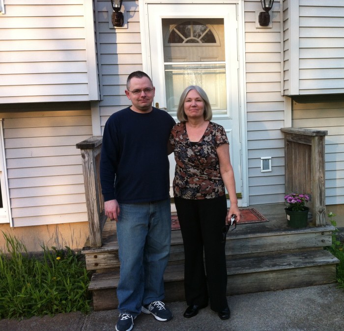 Daryl and Karen, in front of his new house.
