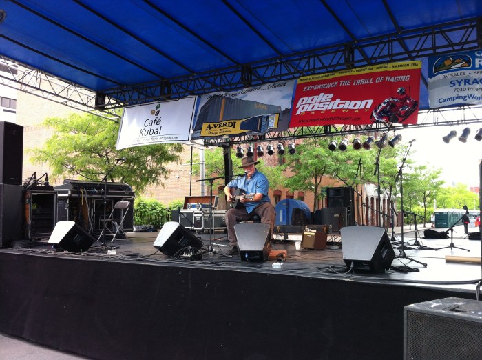 Colin Aberdeen plays on one side of Clinton Square.