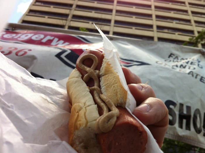 Hot dog, with spicy mustard.