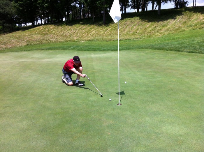 KP leaves his shot on the first hole four inches from the cup.