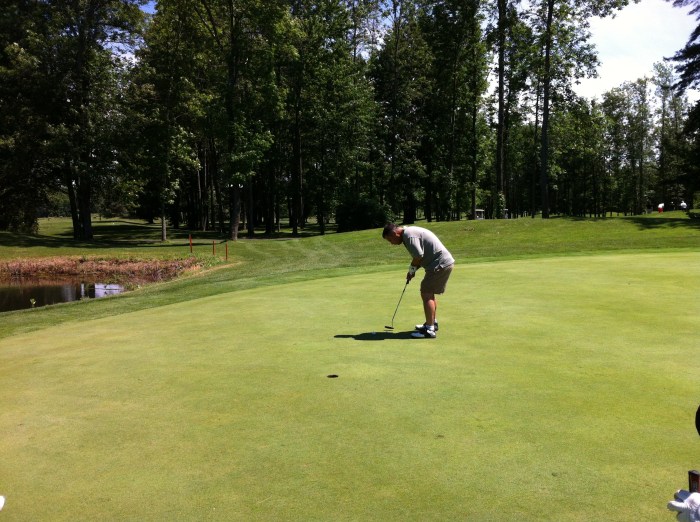 Gator lines up a putt.