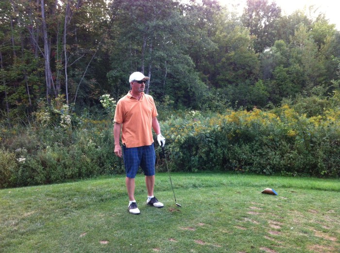 Bird watches his tee work.