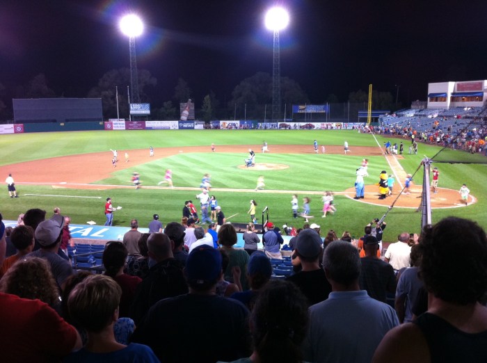 Kids run the bases Sunday after the Syracuse Chiefs beat the Buffalo Bison 4-3 with a walk-off homer in the ninth. 