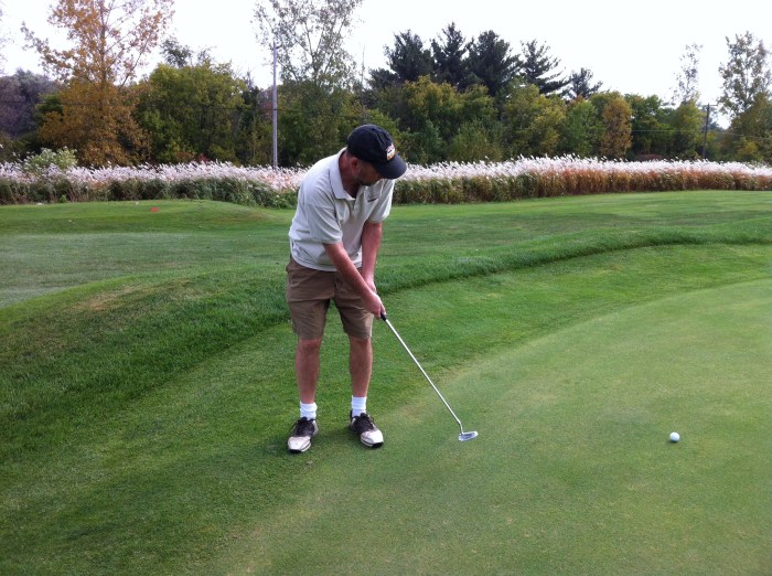 I putt, my daughter snaps. 