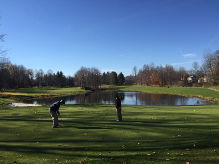 KP putts as Tater holds the pin at Radisson Greens on Nov. 22 in Baldwinsville, N.Y., northwest of Syracuse.