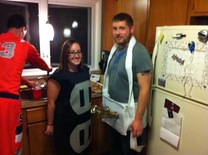 Our hosts. Shocking costume, no?