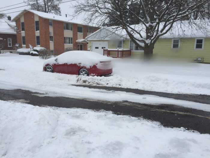 Illegally parked car on my Syracuse street.