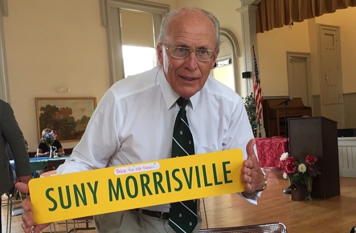 Neal Bandlow and his custom sign for our table. 