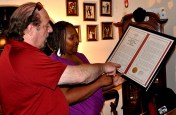 Jim Pavente and Shuana Dean look over her father Roosevelt's cherished memorabilia. (Photo by Tom Honan)