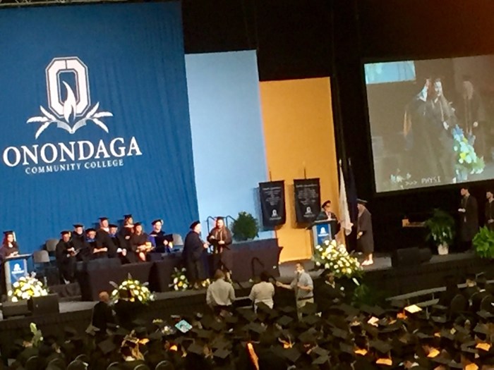 Receiving her diploma.