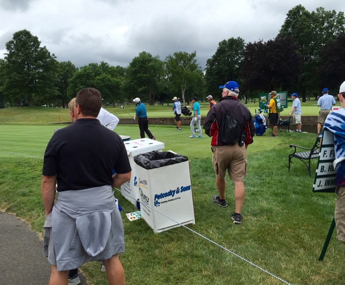 Between the patrons.