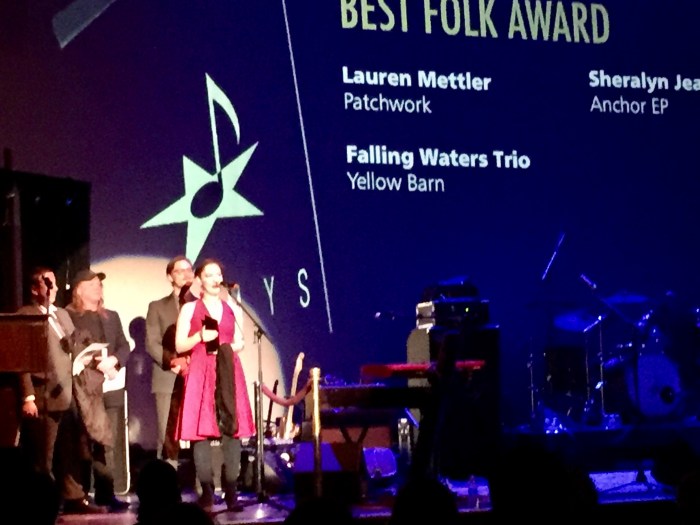 Lauren Mettler carries her jacket to the stage.